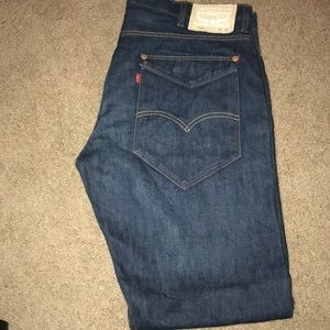 Straight, dark blue jeans.